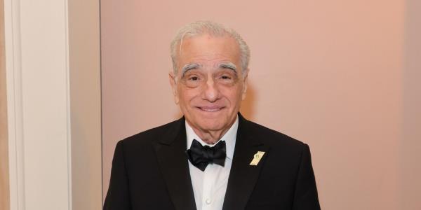 Martin Scorsese smiling in a tuxedo