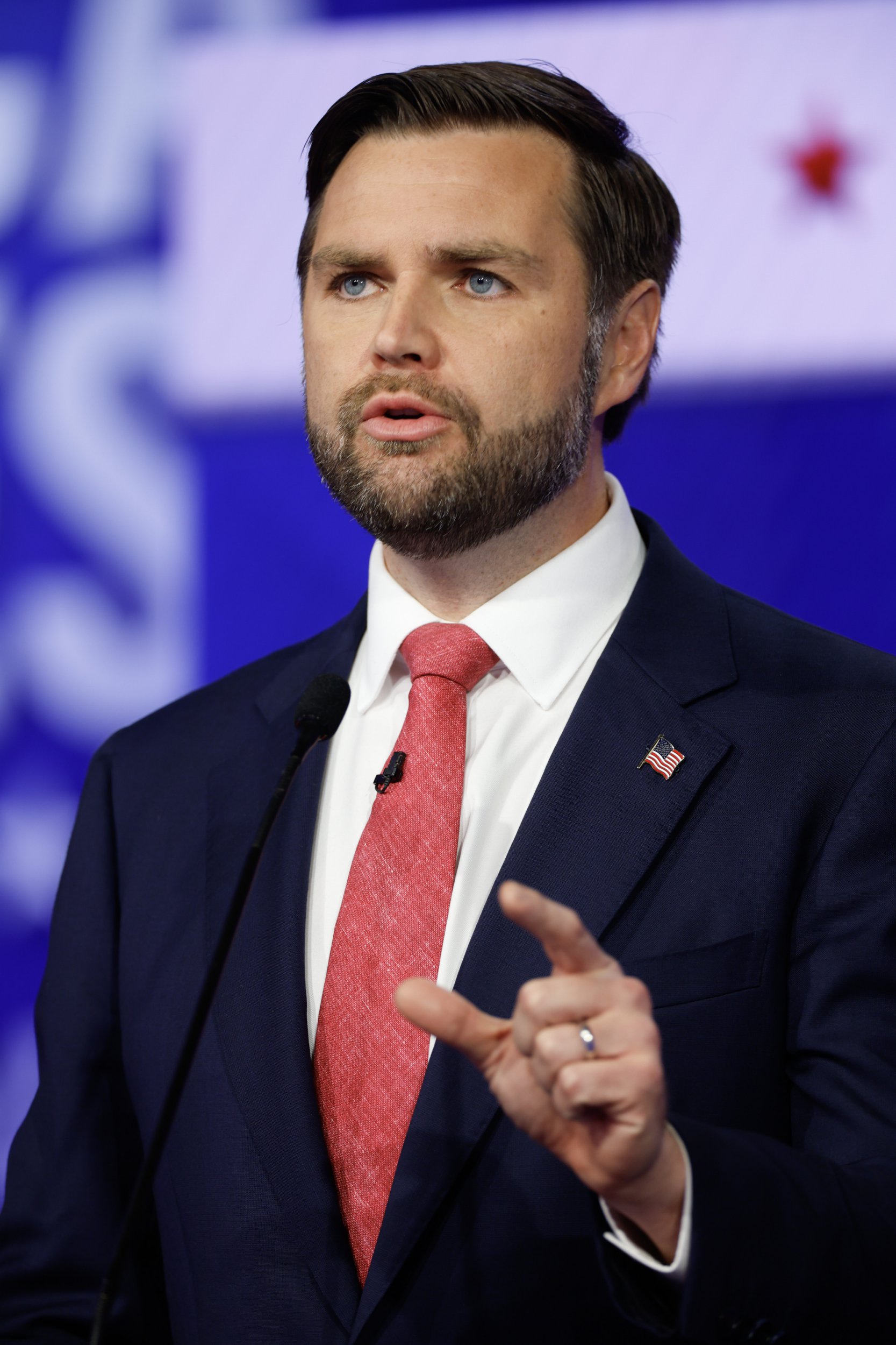 Republican vice presidential candidate JD Vance gestures with his left hand during the vice presidential debate on Tuesday night